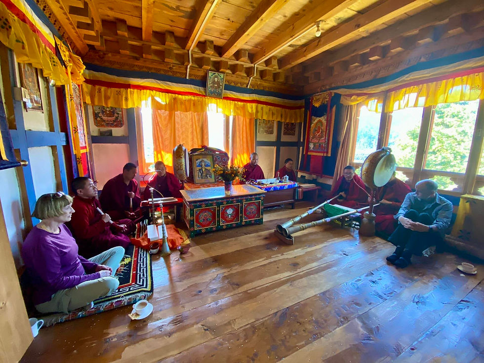 Monks from Gangtey monastery performing annual blessings in a family farm home, Gangtey, Bhutan.