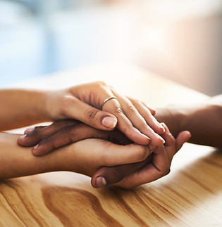 Interracial couple, hands and sympathy with support for trust, relationship or commitment