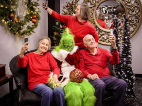My parents and I having fun posing with the Grinch
