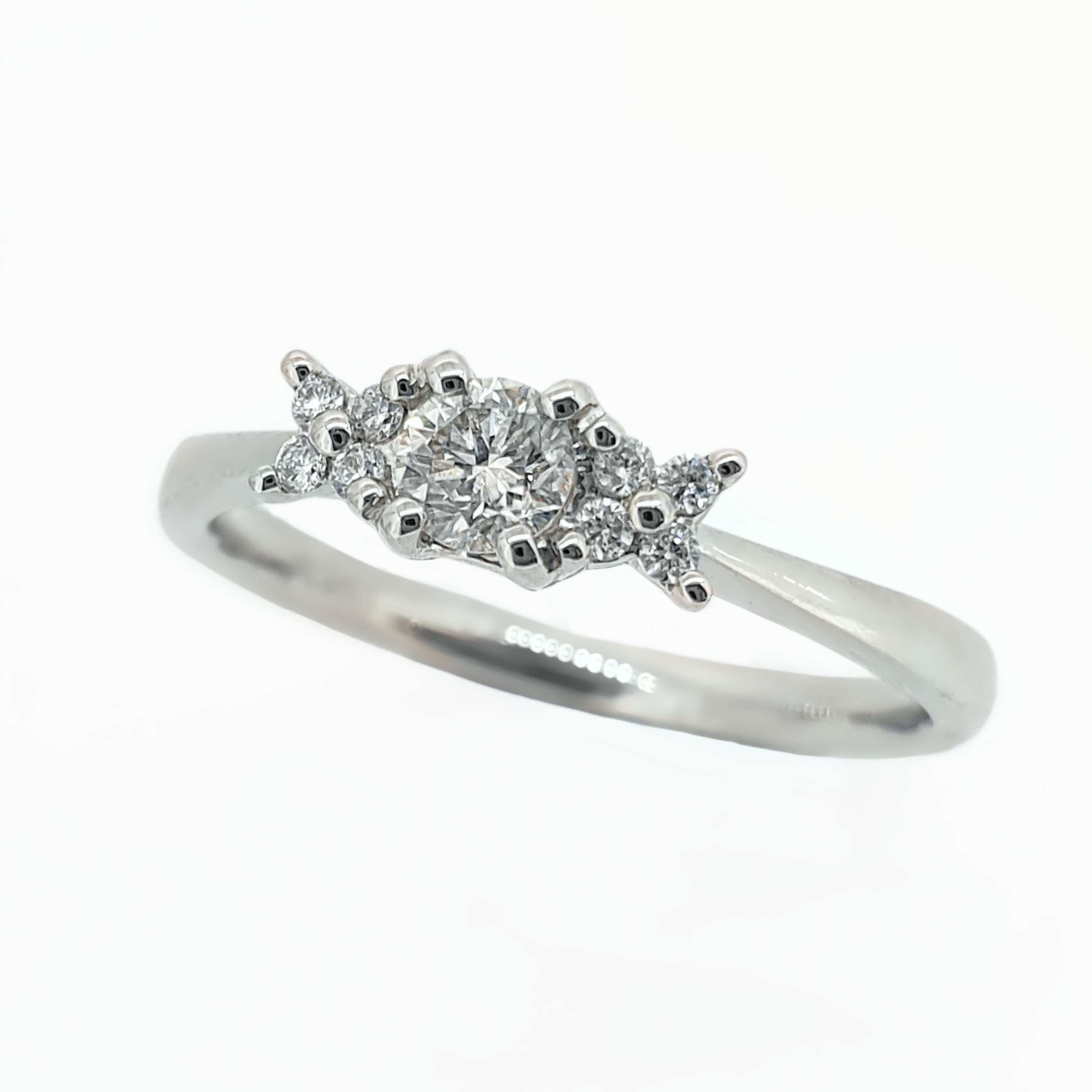 Diamond Engagement Ring with Flower Style Set Shoulders in Platinum