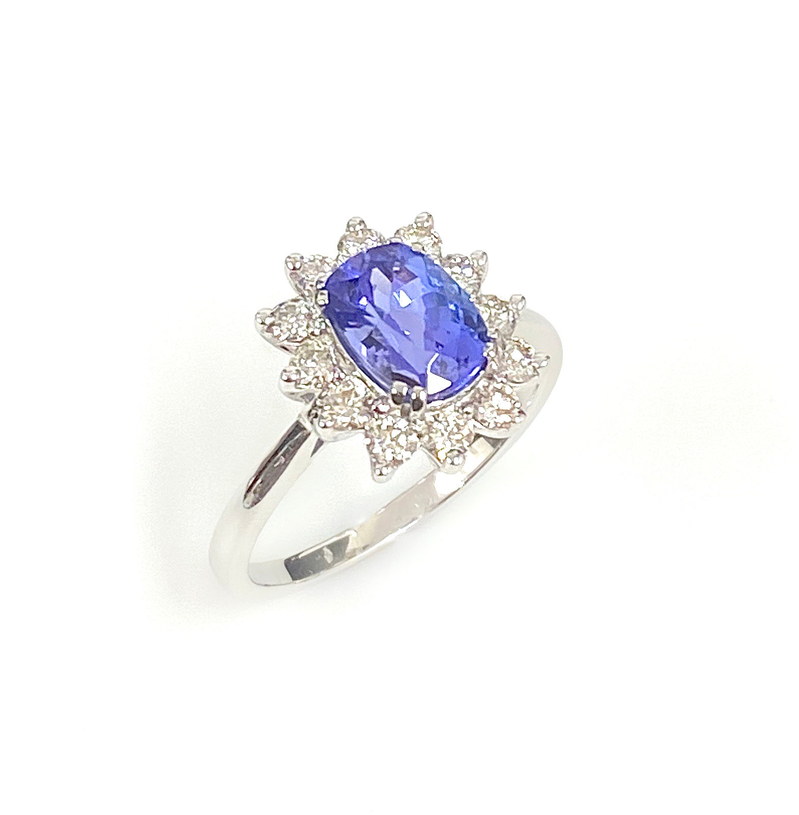 9 Carat White Gold Oval Tanzanite and Diamond Cluster Ring