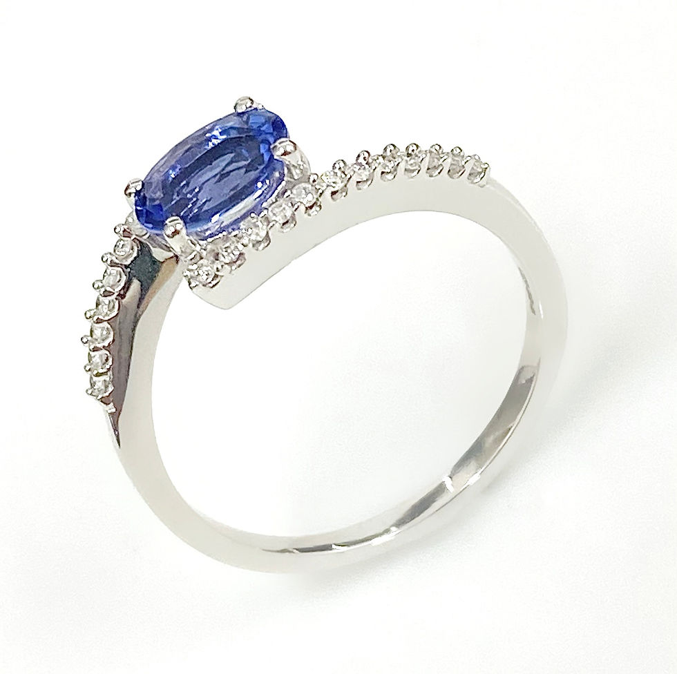 Thumbnail: Oval Brilliant Cut AAA Grade Tanzanite & Diamond Twist Ring in 18 Carat Gold