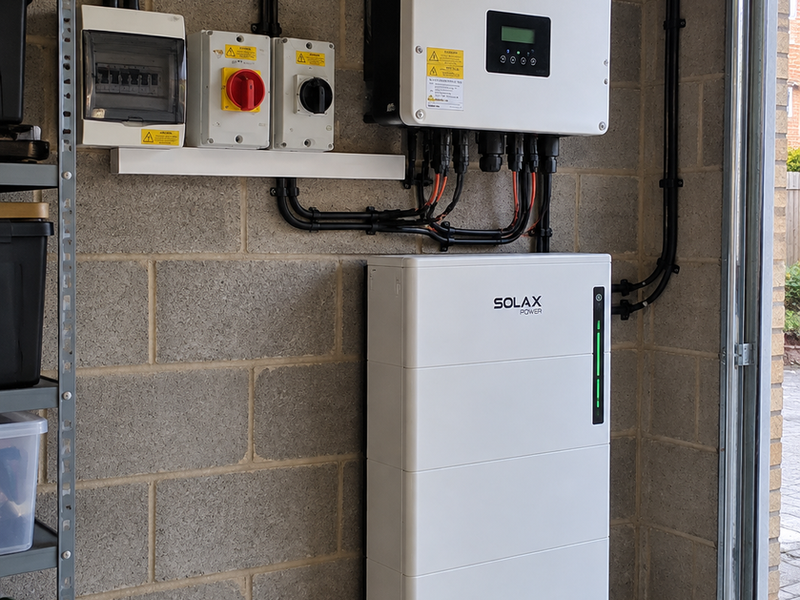 SolaX hybrid inverter and Triple Power battery installed in a garage
