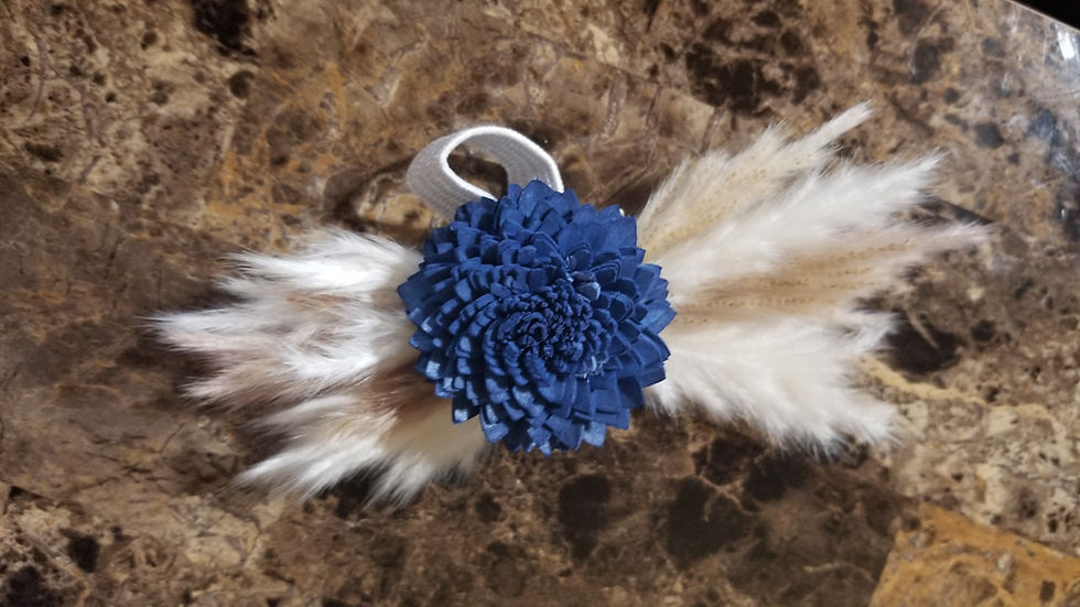 Navy Blue bali sola wood flower with tan and white pampas on both sides/ The corsage is on the wrist with elastic band.
