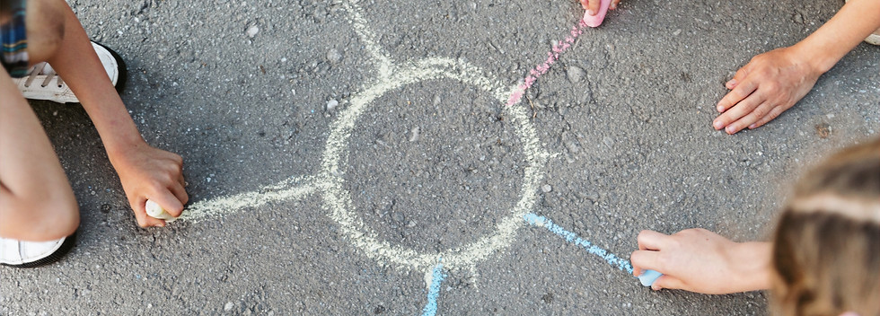 kids-drawing-sun-with-chalk_edited.jpg