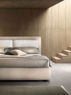 Letto con cuscini e contenitore in tessuto antimacchia