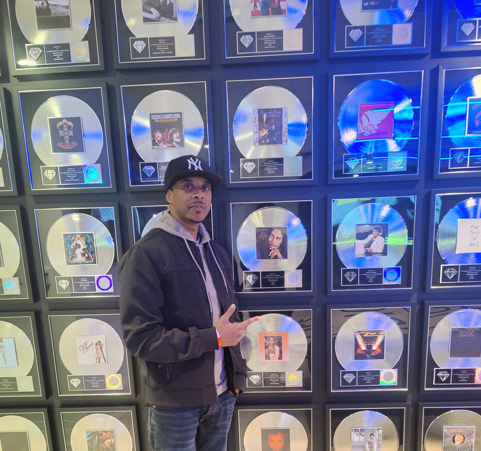 City the Great at the RIAA Headquarters in D.C in front of legendary Platinum Plaques