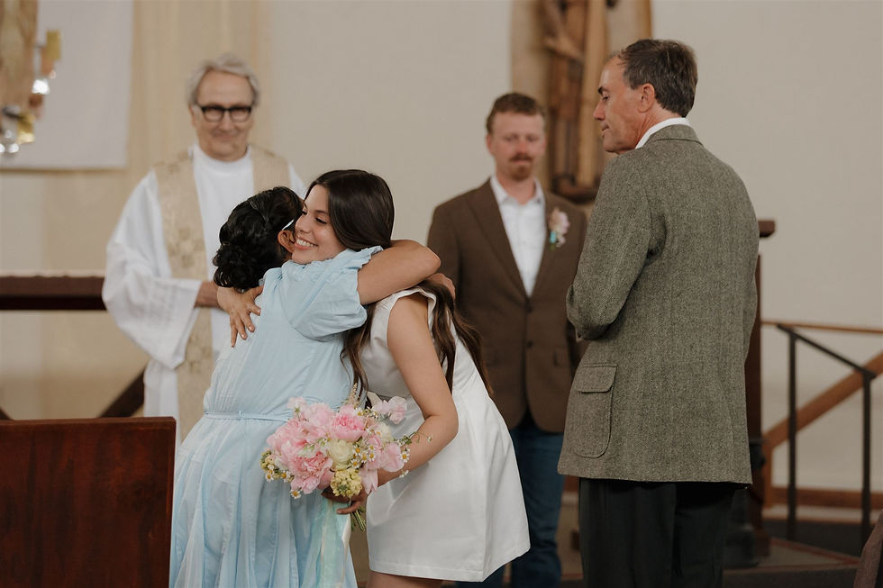 Candid moment with brides family during ceremony at Nativity SLO Church in San Luis Obispo by Micro Wedding Photographer MacKenzie Rana Photography