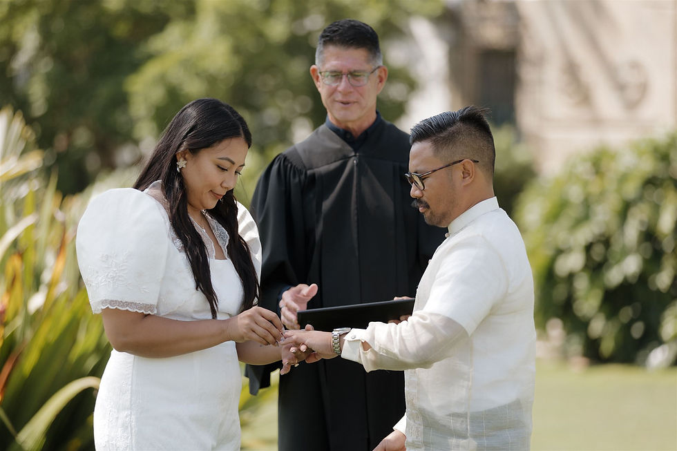 Candid ring exchange at Santa Barbara Courthouse wedding by MacKenzie Rana Photography