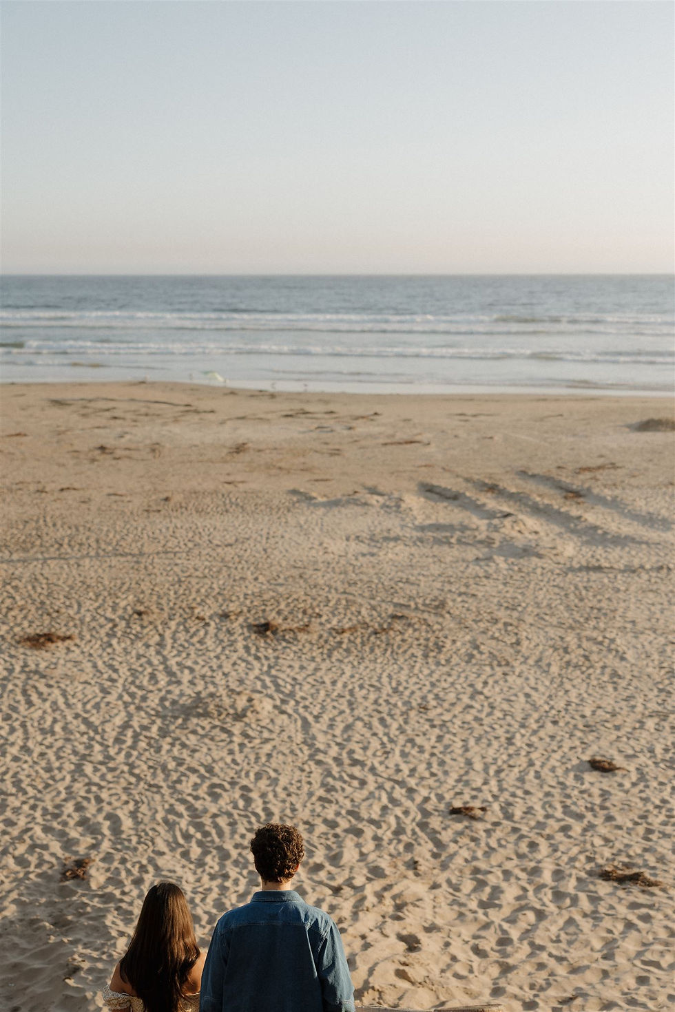 Documentary-style couple portraits on Pismo Beach by MacKenzie Rana Photography