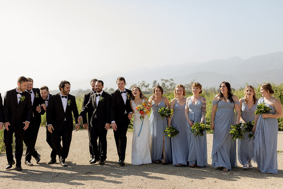Candid wedding party portraits on Carpinteria Bluff wedding ceremony by wedding photographer MacKenzie Rana