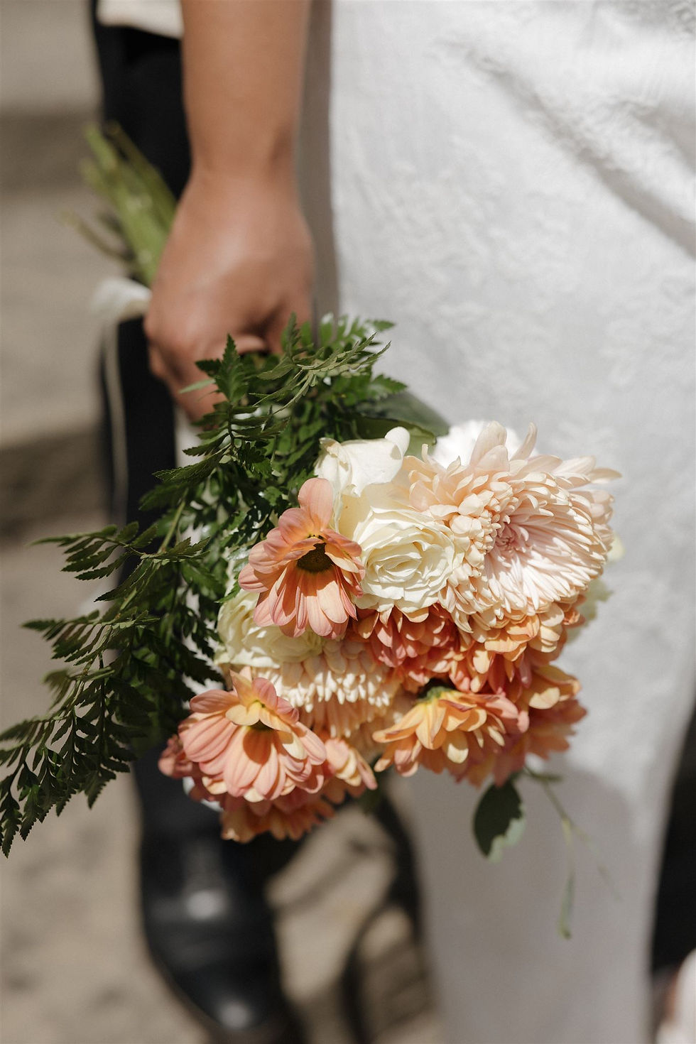 Bride holding bouquet at Santa Barbara Courthouse wedding by MacKenzie Rana Photography