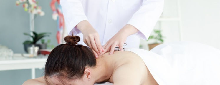 hand-of-doctor-performing-acupuncture-th