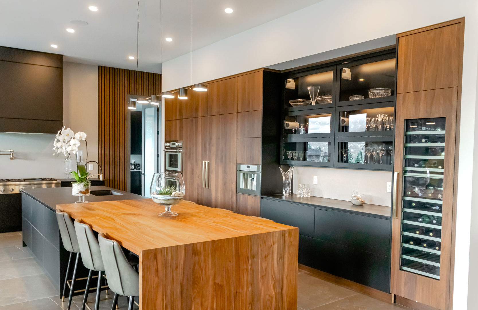 The project featured a contemporary kitchen, custom millwork installations, unique bathroom vanities, a functional home office, and stylish walk-in wardrobe designs.