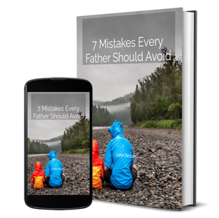 Man and Child Sitting On Creek Bed