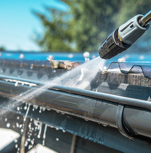 vecteezy_rain-gutters-pressure-cleaning_24611012.jpg