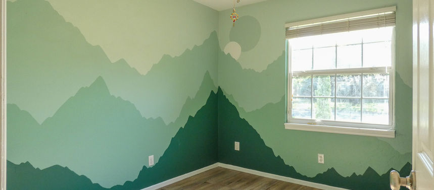 Bedroom with mountain mural, wood floor, window, and ceiling fan