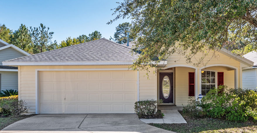 Exterior view of a house Sorrento $299,900 with a garage and tree coverage