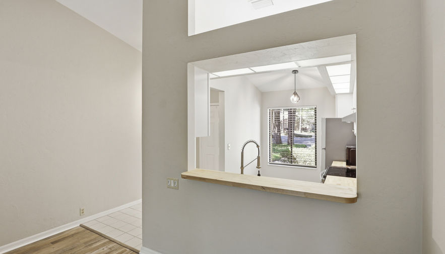 Pass-through window from living area to kitchen