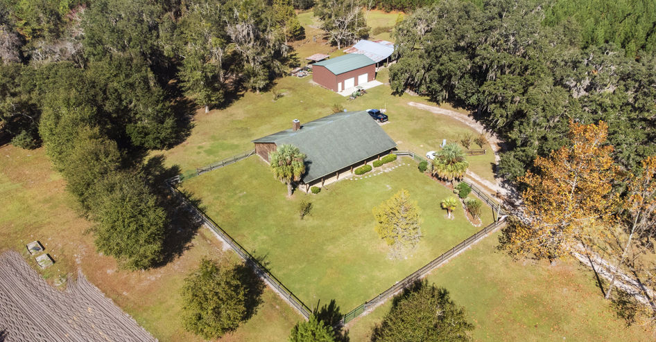 Aerial view of a house surrounded by greenery, Alachua 33.45 Acres $720,000, land.