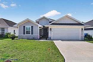 Modern single-story house with gray siding and garage