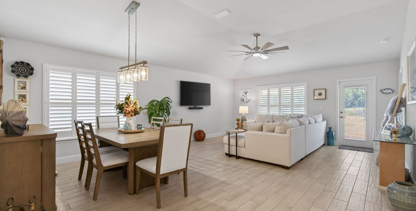 Modern open-plan living and dining room with light decor