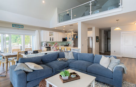 A wide interior shot of the main living level in a custom modular home.