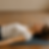 a woman laying down practicing body scan meditation