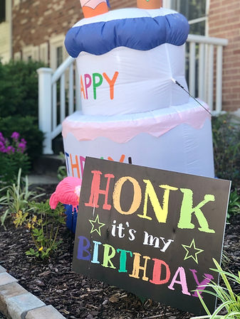 celebratory-inflatable-cake-and-honk-birthday-sign-2026-03-11-00-50-52-utc.jpg