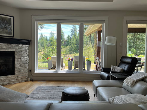 Bright living room windows overlooking Predator Ridge