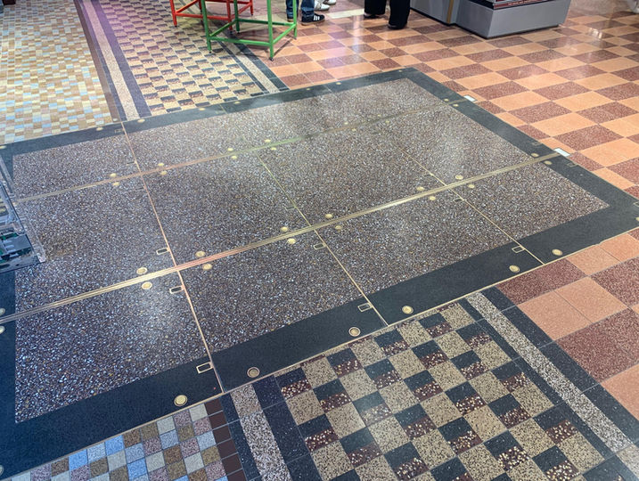 Abstract and geometric style of terrazzo floors. Beautiful black squares, and checkered patterns, with a shining gloss.