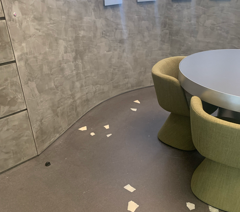 White floor pieces on shining grey floor, set in a modern room.