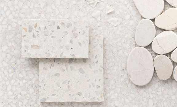 Three sizes of white ice terrazzo tiles; interlaced over each other for the architectural mind.