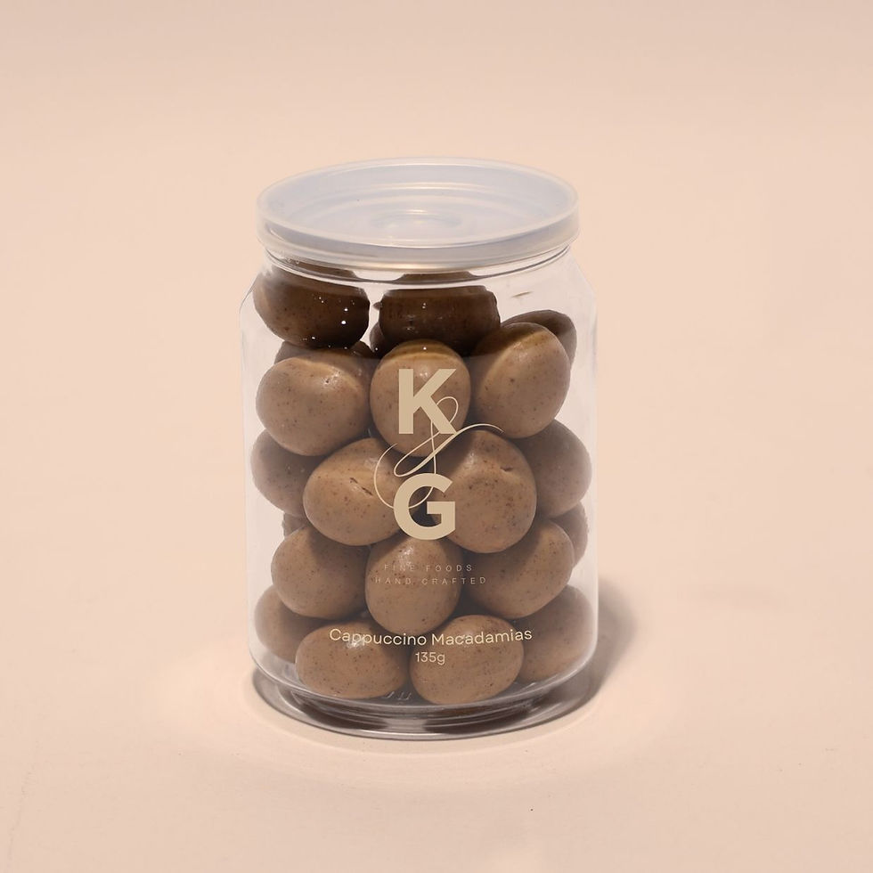 A jar of roasted macadamias coated in golden chocolate and ground espresso.