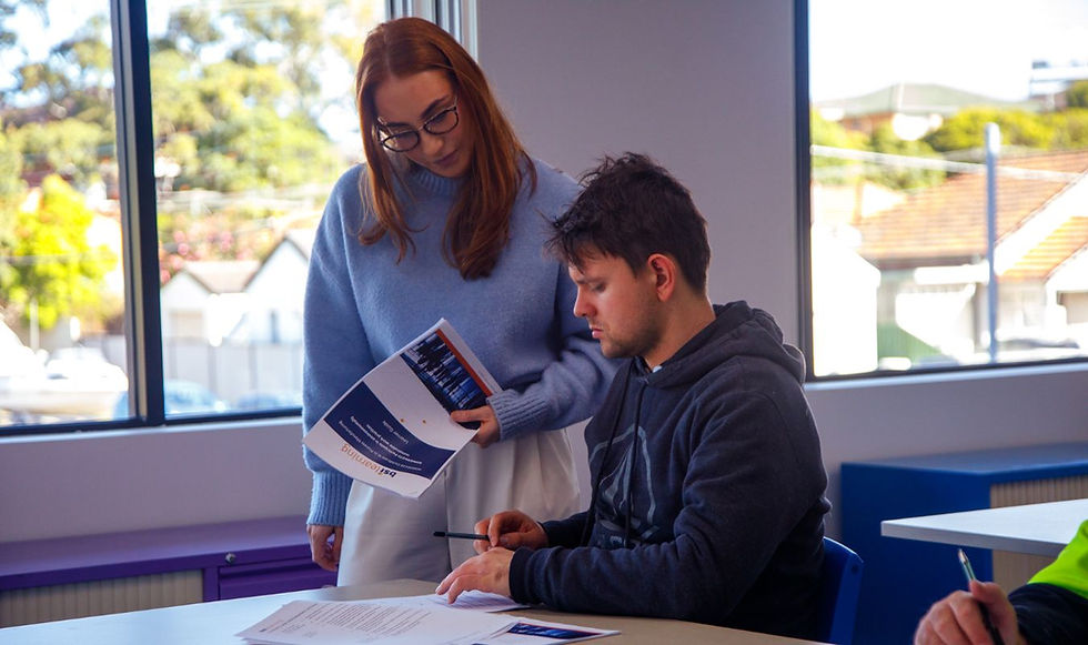 teacher helping a participant in the School Leaver Support program