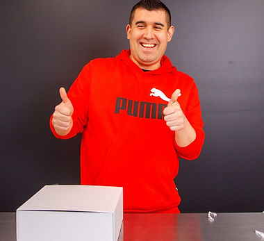 IDF of St George Participant giving a thumbs up to the camera after finishing his hamper packing for work