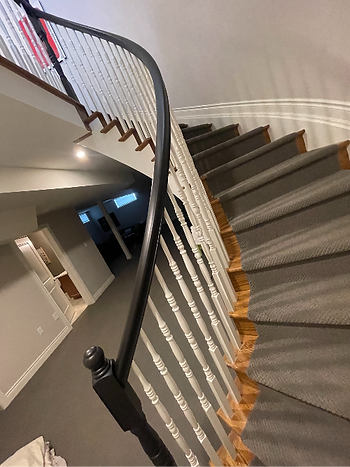 A beautiful black handrail and spindles.