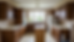 Wide-angle view of a dated Gloucester kitchen with dark wooden cabinets before painting
