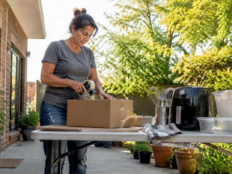 Homeowner packing kitchen supplies for remodel