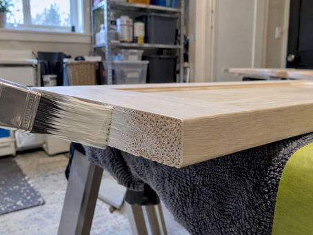 Primer sealing the exposed edge of a cabinet door