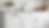 Eye-level view of freshly painted white kitchen cabinets with modern handles