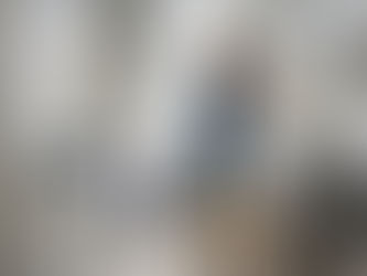 Woman painting cabinets in small Ottawa kitchen