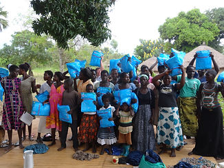 farmers holding up mosquito nets