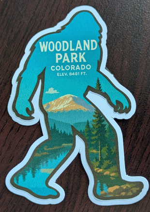 Bigfoot Sasquatch silhouette Bumper sticker with the elevation and city name of "Woodland Park, Co. and the Elevation of 8,84