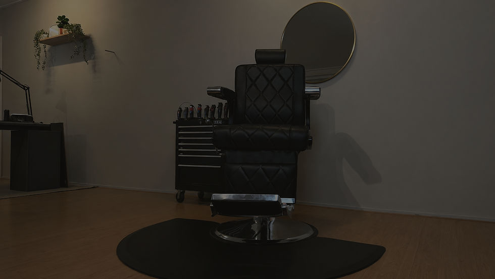 Eye-level view of a sleek barber chair in a modern studio