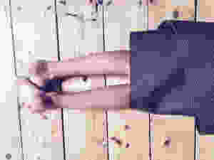 child's feet sticking out of yoga mat