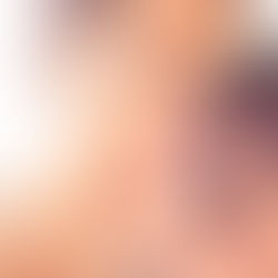 Anxious woman looking at her skin in the mirror
