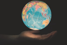 Earth in the palm of a hand showing Indi