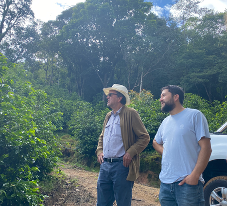 Walking the farm with Don Johel and Matías, trading ideas under the shade.