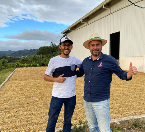 Coffee exporter and producer waving in a coffee farm